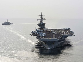 U.S. Navy/Mass Communication Specialist Seaman Anna Van Nuys
The aircraft carrier USS Theodore Roosevelt (CVN 71) and the guided-missile cruiser USS Normandy (CG) 60 sail in the Arabian Sea, in this U.S. Navy photo taken April 16, 2015. The ships will join seven other U.S. warships in the waters near Yemen, which is torn by civil strife as Iranian-backed Houthi rebels battle forces loyal to the U.S.-backed president.