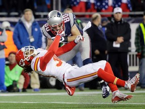 New England Patriots' Danny Amendola hits Kansas City Chiefs' Jamell Fleming in the first half of an NFL divisional playoff football game, Saturday, Jan. 16, 2016, in Foxborough, Mass. (AP/Steven Senne)