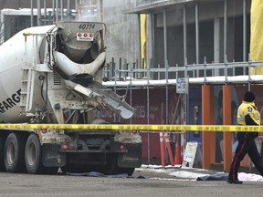 A pedestrian was killed in a downtown crash involving a concrete truck at a crosswalk at 107 Street and 103 Avenue, Jan. 22, 2016. (ED KAISER/PHOTOGRAPHER)