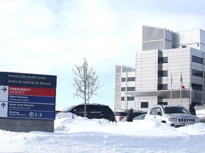 A sign points to the parking lot at Health Sciences North on January 18, 2016. (Gino Donato/Sudbury Star)
