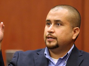 In this Tuesday, Sept. 22, 2015 file photo, George Zimmerman gestures during his testimony at a hearing for accused shooter Matthew Apperson in Seminole circuit court in Sanford, Fla. George Zimmerman is officially divorced. The Orlando Sentinel reports that a Seminole County judge signed the divorce order Tuesday, Jan. 19, 2016 ending his marriage to Shellie Zimmerman.  (Joe Burbank/Orlando Sentinel via AP, Pool, File)