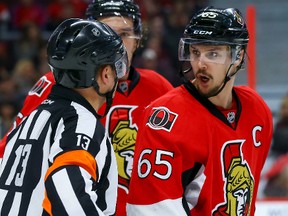 Ottawa Senators defenseman Erik Karlsson argues a call with referee Dan O'Halloran on Jan. 22. (Errol McGihon/Ottawa Sun)