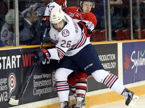 Arthur Tyanulin (R) of the Ottawa 67's is hit by Daniel Robertson of the Oshawa Generals on Jan. 22. (Jean Levac, Postmedia Network)