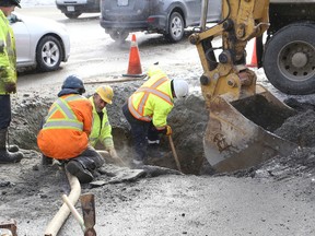 A crew works on a watermain break on Barrydowne Road at Westmount Avenue in Sudbury, Ont. on Saturday January 23, 2016. John Lappa/Sudbury Star/Postmedia Network