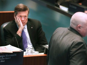 Mayor John Tory stares at his predecessor, Rob Ford. File pic. (Veronica Henri/Toronto Sun/Postmedia Network)