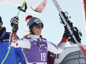 Canada’s Larisa Yurkiw celebrates her second-place finish in the World Cup downhill in Cortina D’Ampezzo, Italy, Saturday, Jan. 23, 2016. (AP Photo/Armando Trovati)