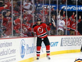 New Jersey Devils right wing Lee Stempniak celebrates after scoring a goal against the Calgary Flames during the second period of an NHL hockey game, Tuesday, Jan. 19, 2016, in Newark, N.J. (AP Photo/Julio Cortez)