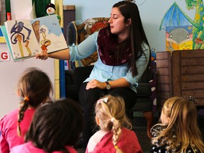 Sarah Basinski, children’s librarian at the Belleville Public Library, reads to a room full of young children during the library's Family Literacy Day event on Saturday January 23, 2016 in Belleville, Ont. Tim Miller/Belleville Intelligencer/Postmedia Network