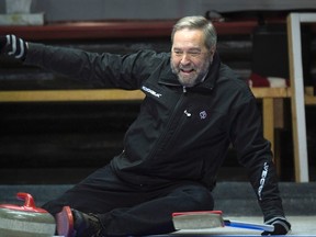 NDP Leader Tom Mulcair as he curls with the NDP Caucus during a retreat in Montebello, Quebec on Tuesday January 19, 2016. THE CANADIAN PRESS/Adrian Wyld