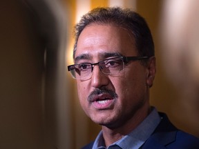 Federal Infrastructure Minister Amarjeet Sohi talks with reporters at a cabinet retreat at the Algonquin Resort in St. Andrews, N.B. on Sunday, Jan. 17, 2016. (THE CANADIAN PRESS/Andrew Vaughan)