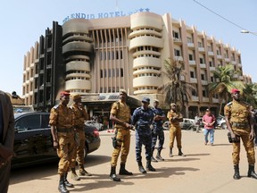 Soldiers stand guard in front of the Splendid Hotel after an attack on the hotel and a restaurant in Ouagadougou, Burkina Faso, January 18, 2016. REUTERS/Joe Penney