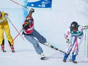 France's Jean Frederic Chapuis, right, edges out Canada's Brady Leman, centre, to win men's final at the World Cup ski cross event at Nakiska Ski resort in Kananaskis, Alta., Saturday, Jan. 23, 2016. (THE CANADIAN PRESS/Jeff McIntosh)