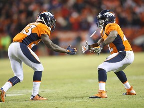 Denver Broncos running back Ronnie Hillman (left) celebrates with Denver Broncos running back C.J. Anderson (right) after scoring a touchdown during the second half against the San Diego Chargers at Sports Authority Field at Mile High. (Chris Humphreys/USA TODAY Sports)