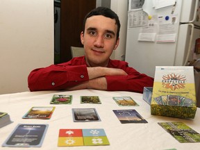 Trevor Lehmann, owner of Convergent Games, displays a family card game he designed called Crop Cycle. (Kevin King/Winnipeg Sun/Postmedia Network)