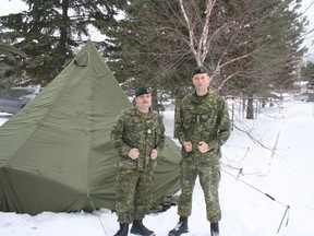Canadian reserve soldiers Sgt. Shaun Magill and Cpt. Jon Baker of Kenora’s 116th Independent Field Battery have warmed up considerably outside the Kenora Armoury on Saturday, Jan. 23, 2016. The two soldiers attended an arctic training exercise in Gimli, MB., on Jan. 16-17 in preparation of a larger scale training session in Resolute Bay and Polaris, NU., from Feb. 12-21. 
RYAN YOUNG/Miner and News/Postmedia Network