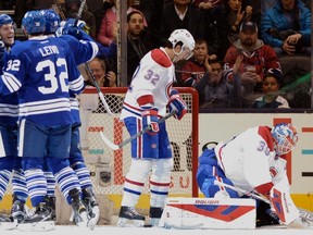 Toronto Maple Leafs' Joffrey Lupul (19) celebrates his game tying goal against the Montreal Canadiens with teammates during third period NHL action in Toronto on Saturday, Jan. 23, 2016. THE CANADIAN PRESS/Frank Gunn