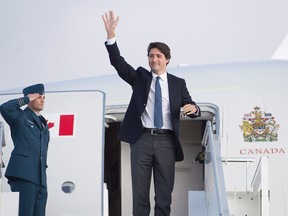 Prime Minister Justin Trudeau waves as he departs Zurich on Saturday, Jan. 23, 2016. Trudeau attended the World Economic Forum in Davos. THE CANADIAN PRESS/Andrew Vaughan