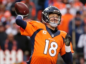 Denver Broncos quarterback Peyton Manning passes during the second half of the NFL football AFC Championship game between the Denver Broncos and the New England Patriots, Sunday, Jan. 24, 2016, in Denver. (AP Photo/Charlie Riedel)