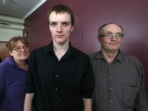 Zachary Miller poses with his mother Pam and father Lyle in the offices of the Canadian Centre for Child Protection in Winnipeg on Sunday, Jan. 24, 2016. (Kevin King/Winnipeg Sun/Postmedia Network)
