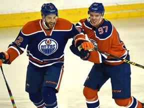 Oilers teammates Eric Gryba and Connor McDavid horse around during the team's skills competition Sunday at Rexall Place. (Ed Kaiser)