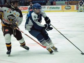 Nickel Capital Wolves' forward Nicholas Chokan shields the puck away from a Timmins Majors player during GNML action at the Sudbury Community Arena on Saturday. The Nickel Caps won 7-5. Keith Dempsey/For The Sudbury Star