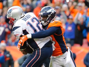 New England Patriots quarterback Tom Brady (12) is tackled by Denver Broncos outside linebacker Von Miller (58) in the third quarter in the AFC Championship football game at Sports Authority Field at Mile High. Kevin Jairaj-USA TODAY Sports