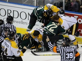 Several players from the Sarnia Sting and London Knights engage in a line brawl with 1:21 remaining in the Ontario Hockey League game at Budweiser Gardens on Saturday, Jan. 24, 2016 in London, Ont. The battle continued with more fights during the equipment cleanup. (Terry Bridge, The Observer)