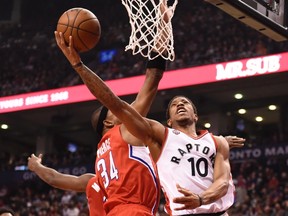 Raptors' DeMar DeRozan drives to the basket against Los Angeles Clippers' Paul Pierce during first-half action in Toronto on Sunday. (THE CANADIAN PRESS/PHOTO)
