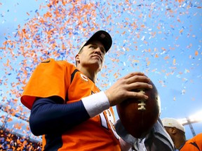 Denver Broncos quarterback Peyton Manning (18) celebrates after defeating the New England Patriots in the AFC Championship football game at Sports Authority Field at Mile High. Mark J. Rebilas-USA TODAY Sports      TPX IMAGES OF THE DAY