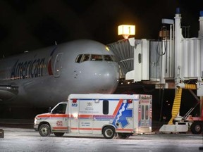 An ambulance departs St. John's International Airport on Sunday, January 24, 2016. Several passengers and crew were taken to hospital with unspecified injuries that occurred when their American Airlines flight heading to Milan from Miami encountered severe turbulence. THE CANADIAN PRESS/Paul Daly