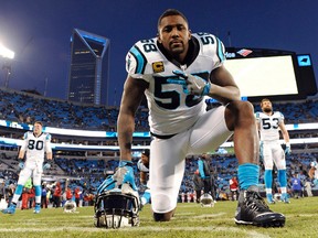 Carolina Panthers' Thomas Davis warms up before the NFL football NFC Championship game against the Arizona Cardinals Sunday, Jan. 24, 2016, in Charlotte, N.C. (AP Photo/Mike McCarn)