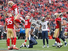 San Francisco 49ers free safety Eric Reid celebrates with strong safety Jimmie Ward after breaking up a pass against the St. Louis Rams. (Cary Edmondson/USA TODAY Sports)