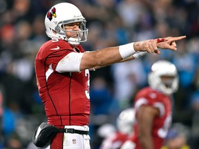 Arizona Cardinals quarterback Carson Palmer signals at the line of scrimmage during the third quarter against the Carolina Panthers in the NFC Championship game at Bank of America Stadium in Charlotte on Jan. 24, 2016. (Bob Donnan/USA TODAY Sports)