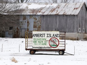 A billboard protesting the proposed wind energy project greets ferry passengers arriving on Amherst Island, including members of the Environmental Review Tribunal, which started on Monday, Jan. 25, 2015. Tribunal members, parties, participants and presenters with authorization took part in a tour of the island prior to the start of three days of hearings on the island.
Elliot Ferguson/The Whig-Standard/Postmedia Network