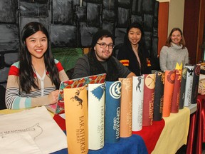 Members of the Queen's University chapter of Room to Read, Rene Zou, left, Eric Sandhog, Sophia Su and Amy Haddlesey, have set up a Game of Thrones themed castle camp site in the Joseph S. Stauffer Library for the entire week to help raise money and awareness during Literacy Week in Kingston, Ont. on Monday January 25, 2016.  Julia McKay/The Whig-Standard/Postmedia Network