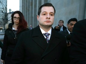 Toronto Police Const. James Forcillo leaves 361 University Ave courthouse after being found guilty of attempted murder in the 2013 shooting death of Sammy Yatim on Monday, January 25, 2016. (Craig Robertson/Toronto Sun)