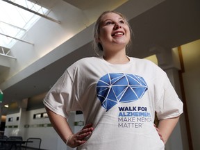 Luke Hendry/The Intelligencer
The Alzheimer Society of Hastings-Prince Edward's Amelia Huffman wears a shirt promoting this year's Walk for Alzheimer's outside the society office in Belleville Friday. Demand for the society's programs is rising, as is the number of people with dementia in Canada.