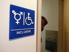 A gender-neutral bathroom shows one type of gender-neutral signage.
