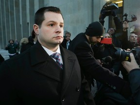 Const. James Forcillo leaves 361 University Ave. courthouse in Toronto after being found guilty of attempted murder in the 2013 shooting death of Sammy Yatim on Monday January 25, 2016. (Craig Robertson/Toronto Sun)