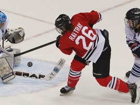 Jamie-Lee Rattray of Team Red takes a shot on goalie Sami Jo Small, of Team White, during the CWHL all-star game on Dec. 13, 2014 at the Air Canada Centre in Toronto. (Veronica Henri/Toronto Sun/Postmedia Network)