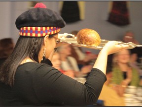 Sarah Brown paraded in the haggis as is tradition at a Robbie Burns celebration.