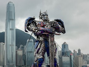 A 20 foot-tall Optimus Prime figure is displayed in front of the city skyline before the world premiere of Hollywood movie Transformers 4 in Hong Kong in 2014. (AFP PHOTO / Philippe Lopez)