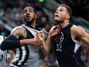 Los Angeles Clippers forward Blake Griffin (32) and San Antonio Spurs forward LaMarcus Aldridge (12) fight for position under the basket at the AT&T Center. San Antonio won 115-107. Erich Schlegel-USA TODAY Sports