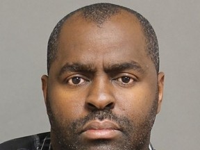 Clinton Russell, 42, faces charges after he allegedly sexually assaulted a girl, 17, on Jan. 8 while working as a school-based safety monitor at Weston Collegiate institute. (Handout/Toronto Police)