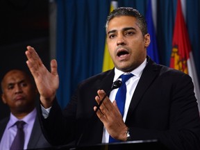 Mohamed Fahmy hold a news conference about the "Protection Charter" in Ottawa on Tuesday, Jan. 26, 2016. (THE CANADIAN PRESS/Adrian Wyld)