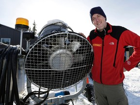 Dave Storey, a ski trail groomer at the Edmonton Nordic Ski Club, shows offthe new snow-making machine at Gold Bar Park on Monday. The club is now equipped to make 240 hours' worth of snow. (Larry Wong photo)