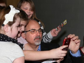 Tim Miller/The Intelligencer
Belleville Mayor Taso Christopher takes a selfie with students from Prince of Wales Public School during their breakfast program on Tuesday in Belleville. Christopher was joined by mayors Robert Quaiff of Prince Edward County and Jim Harrison of Quinte West to present cheques for each of their communities contributions to the Feed the Meter campaign which helps fund meal programs at local schools.