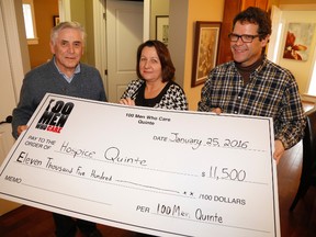 Jason Miller/The Intelligencer
Dr. Gene Manderville (first left), of 100 Men Who Care Quinte and his son Ken Manderville, make a $11,500 donation to Helen Dowdall, executive director of Hospice Quinte.