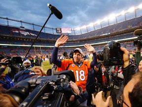 Denver Broncos quarterback Peyton Manning (18) waves to the crowd after defeating the New England Patriots in the AFC Championship football game at Sports Authority Field at Mile High. Kevin Jairaj-USA TODAY Sports