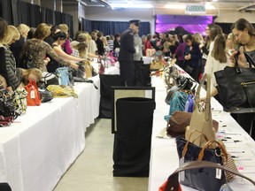 The "Purse Room" at Handbags for Hospice was packed all night long on Friday, January 22, 2016. The event featured hundreds of purses, auctioned off to raise money for VON Sakura House Hospice. (MEGAN STACEY, Sentinel-Review)
